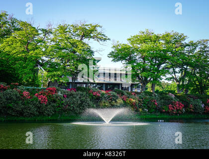 Akita, Japan - May 17, 2017. Lake scenery with fountain at downtown in Akita, Japan. Akita is a large prefecture at the Sea of Japan coast in the nort Stock Photo