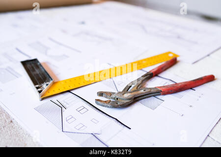 Hammer, nails on wooden boards outside on construction site Stock Photo