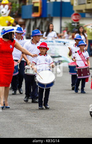 Tilaran, Costa Rica - September 15 : School children marching in the town square playing percussion instruments for the independence day parade. Septe Stock Photo