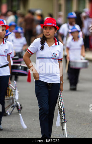 Tilaran, Costa Rica - September 15 : School children marching in the town square playing percussion instruments for the independence day parade. Septe Stock Photo