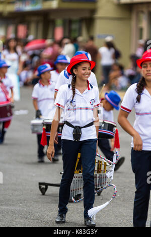 Tilaran, Costa Rica - September 15 : School children marching in the town square playing percussion instruments for the independence day parade. Septe Stock Photo