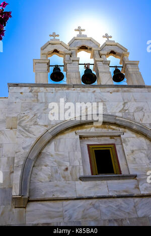 The Monastery of Panagia Tourliani in Mykonos, Greece.  People light candles for dead loved ones, interior and exterior views of the Monestary, bibles. Stock Photo