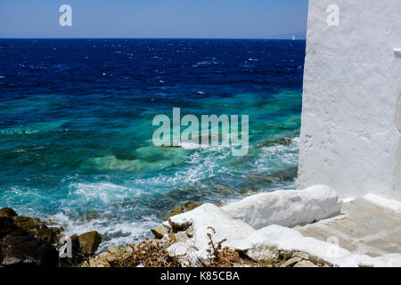 General views of Mykonos, Greece including buildings, flags and waterfront on September 56, 2017. Stock Photo