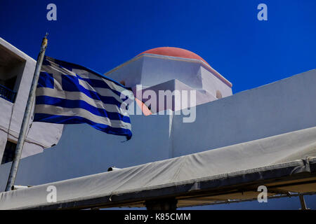 General views of Mykonos, Greece including buildings, flags and waterfront on September 56, 2017. Stock Photo