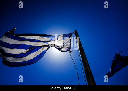 General views of Mykonos, Greece including buildings, flags and waterfront on September 56, 2017. Stock Photo