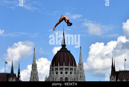 Budapest, Hungary - Jul 28, 2017. Man dives from the 27 metre platform during the semi-final day of men`s High Diving at the FINA World Championships. Stock Photo