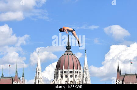 Budapest, Hungary - Jul 28, 2017. Man dives from the 27 metre platform during the semi-final day of men`s High Diving at the FINA World Championships. Stock Photo