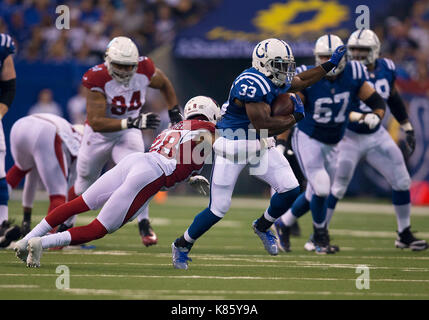 Ot. 17th Sep, 2017. Indianapolis Colts running back Robert Turbin (33) runs with the ball as Arizona Cardinals defensive back Justin Bethel (28) defends during NFL football game action between the Arizona Cardinals and the Indianapolis Colts at Lucas Oil Stadium in Indianapolis, Indiana. Arizona defeated Indianapolis 16-13 in OT. John Mersits/CSM/Alamy Live News Stock Photo