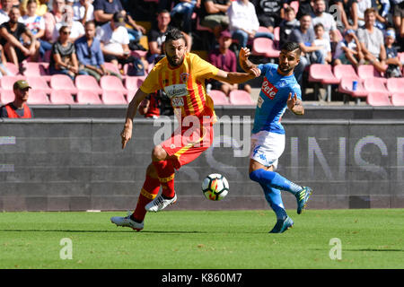 NAPOLI, ITALY - SEPTEMBER 17: Lorenzo Insigne (R) of Napoli and Massimo Coda (L) of Benevento in action during the Serie A football match between SSC Napoli and Benevento Calcio at Stadio San Paolo on September 17, 2017 in Naples, Italy (Photo by Marco Iorio) Stock Photo