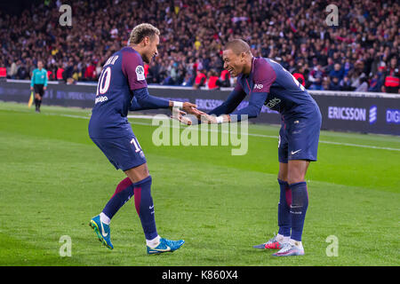 Neymar Jr. and Kylian Mbappe during the French Ligue 1 soccer match between Paris Saint Germain (PSG) and Olympique Lyonnais (OL) at Parc des Princes. On September 17, 2017 in Paris, France Stock Photo