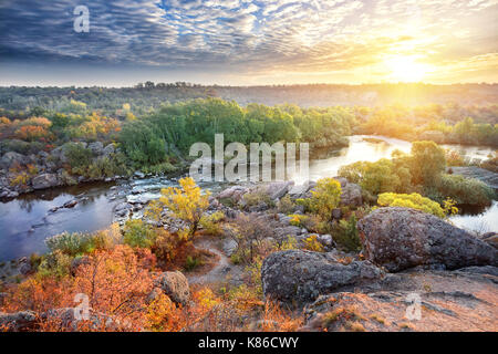 Mountain river among stony shores in the evening. Autumn landscape. The concept of freedom and travel. Stock Photo