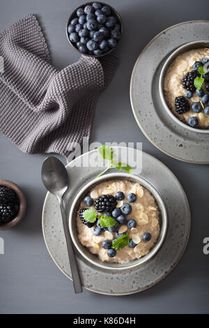 healthy breakfast steel cut oatmeal porridge with blueberry blackberry Stock Photo