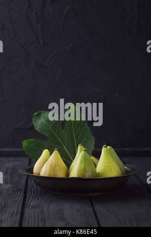 Fresg figs on wood. Fresh fruit on black Stock Photo