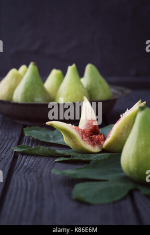 Fresg figs on wood. Fresh fruit on black Stock Photo