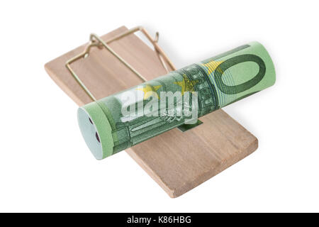 High angle view of rolled euro note on mousetrap against white background Stock Photo