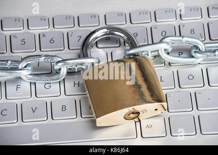 Closeup photo of padlock on laptop. Security concept Stock Photo
