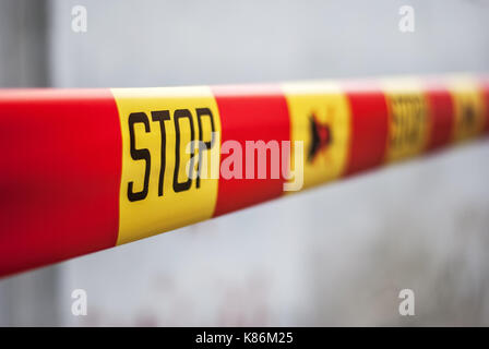 Stop sign ribbon on a construction site Stock Photo