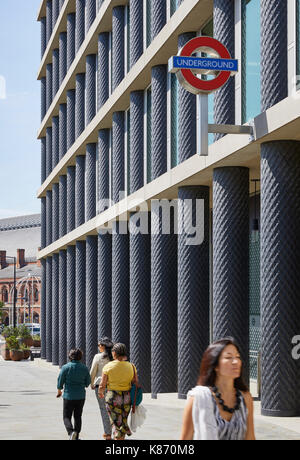 Entrance to St Pancras Underground station, with people walking up the hill. King's Cross Estate, London, United Kingdom. Architect: various architect Stock Photo