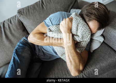 Depressed sad man being in griefb Depressed sad man being in griefb