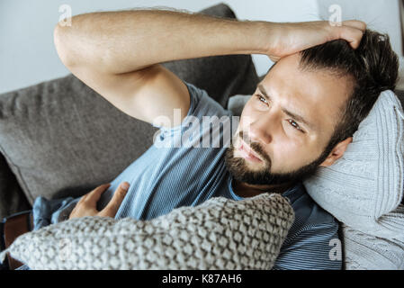 Sad handsome man feeling bad Stock Photo