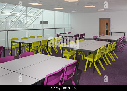 A modern classroom in a new London secondary school converted from a modern office building. Shows teaching space overlooking a large atrium. Stock Photo