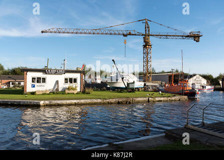 Saul Junction on the Gloucester & Sharpness Canal Gloucestershire UK A large crane and boats in a boatyard. Stock Photo