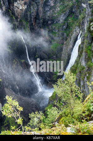 Voringfossen waterfall in norway seen from street level on sunny day Stock Photo