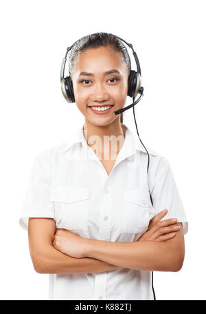 Beautiful Asian business woman with headset. Female operator call center, helpdesk or customer support hotline. Half body vertical portrait of young f Stock Photo