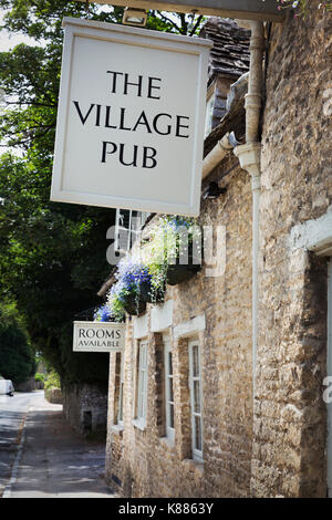 Exterior view of village pub with sign advertising available rooms. Stock Photo