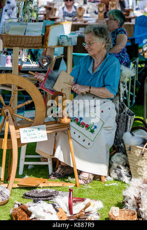 An Elderly Woman Spinning Wool, Hartfield Village Fete, Hartfield, Sussex, UK Stock Photo