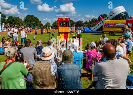 A Traditional Punch and Judy Show On The Village Green, Hartfield Village Fete, Hartfield, Sussex, UK Stock Photo