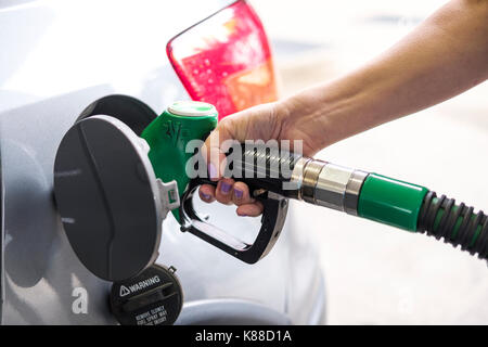 The Cost of driving.Petrol station.Person filling the tank of a vehicle,UK Stock Photo