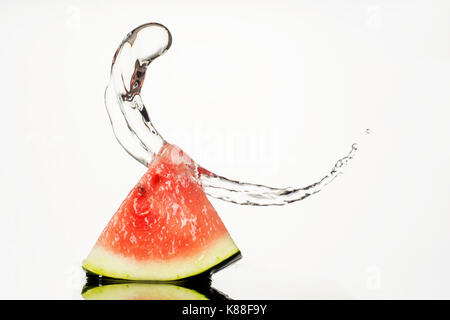 Watermelon With Water Splash isolated on white background Stock Photo