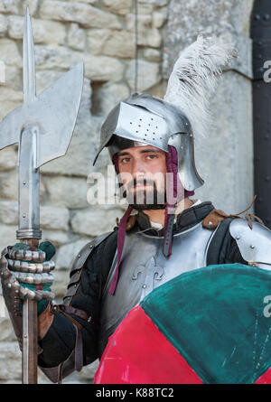 San Marini man dressed in a suit of armour for the annual Medieval Days Festival held in the old town of San Marino in the republic of San Marino. Stock Photo