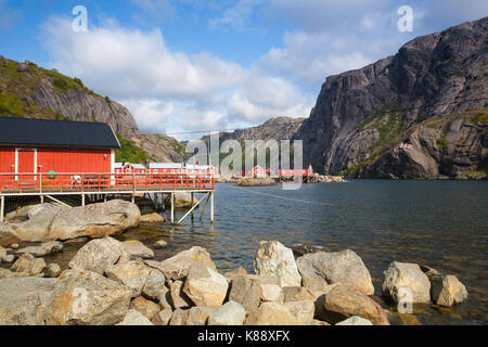 Nusfjord, Norway - August 21,2017: Red Classic Norwegian Rorbu fishing huts, Nusfjord on Lofoten islands. Norwegian traditional type of house used by  Stock Photo