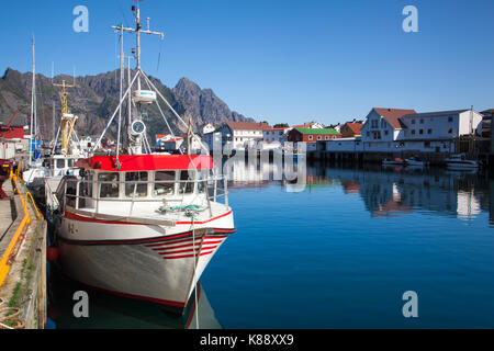 Henningsvaer, Norway - August 19,2017: Picturesque fishing port in Henningsvaer on Lofoten islands, Norway with typical red wooden buildings and small Stock Photo