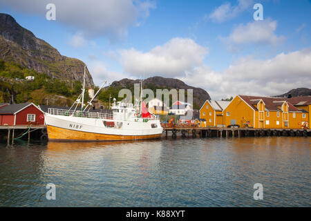 Nusfjord, Norway - August 21,2017: Red Classic Norwegian Rorbu fishing huts, Nusfjord on Lofoten islands. Norwegian traditional type of house used by  Stock Photo