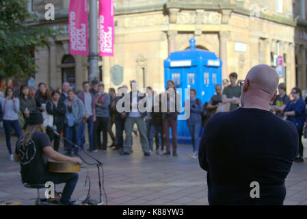 busker musician on Buchanan street style mile Glasgow with large crowd people make Glasgow Stock Photo