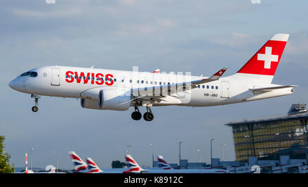 A Bombardier CSeries CS100 of Swiss approaches London Heathrow Airport's runway 09L. Stock Photo