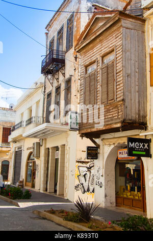 Protruding covered balcony ('sahnisi') made of wood as a typical feature of Rethimno’s architecture. Crete, Greece Stock Photo