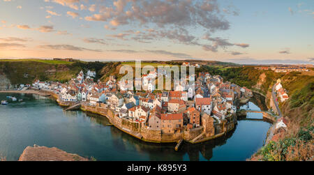 Summer sunrise at Staithes from Cowbar Nab. Stock Photo