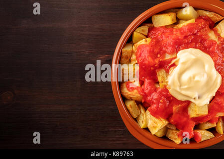 Patatas bravas, Spanish potato dish, overhead closeup shot Stock Photo