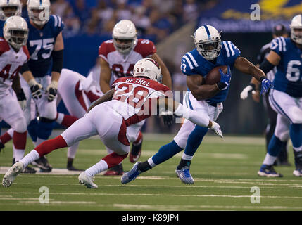 Ot. 17th Sep, 2017. Indianapolis Colts running back Robert Turbin (33) runs with the ball as Arizona Cardinals defensive back Justin Bethel (28) defends during NFL football game action between the Arizona Cardinals and the Indianapolis Colts at Lucas Oil Stadium in Indianapolis, Indiana. Arizona defeated Indianapolis 16-13 in OT. John Mersits/CSM/Alamy Live News Stock Photo