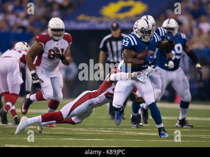 Ot. 17th Sep, 2017. Indianapolis Colts running back Robert Turbin (33) runs with the ball as Arizona Cardinals defensive back Justin Bethel (28) defends during NFL football game action between the Arizona Cardinals and the Indianapolis Colts at Lucas Oil Stadium in Indianapolis, Indiana. Arizona defeated Indianapolis 16-13 in OT. John Mersits/CSM/Alamy Live News Stock Photo