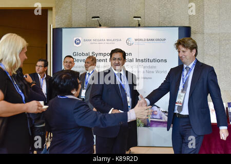 Kuala Lumpur, Malaysia. 19th Sep, 2017. Global Symposium on Development Financial Institutions participants are greeting at the entrance of the auditorium at Sasana Kijang in Kuala Lumpur, Malaysia on Tuesday, September, 19th 2017. More than 700 people from 45 countries attended the symposium. The Symposium will be held until 20th of September. Credit: Chris Jung/ZUMA Wire/Alamy Live News Stock Photo