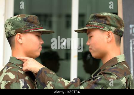 Chongzuo, Chongzuo, China. 16th Sep, 2017. Chongzuo, CHINA-16th September 2017: (EDITORIAL USE ONLY. CHINA OUT).Lin Mingzong and Lin Mingyao are 18-year-old twins soldiers in Chongzuo, southwest China's Guangxi. The twins, born in Quanzhou, southeast China's Fujian Province, entered the army this September. Credit: SIPA Asia/ZUMA Wire/Alamy Live News Stock Photo