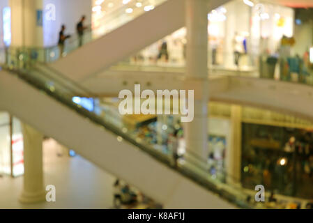 Abstract blurred of people on the escalator going up in the shopping mall Stock Photo