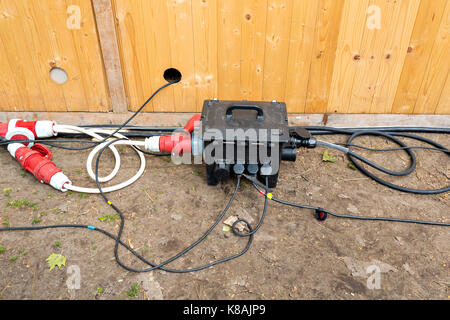 The power three-phase splitter on the earth background Stock Photo