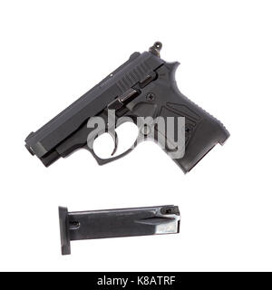 A black pistol with its magazine out. Stock Photo