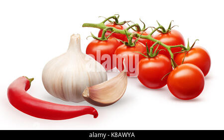 Branch of fresh red cherry tomatoes with green leaves, garlic with clove and red chili pepper vegetables isolated on white background Stock Photo